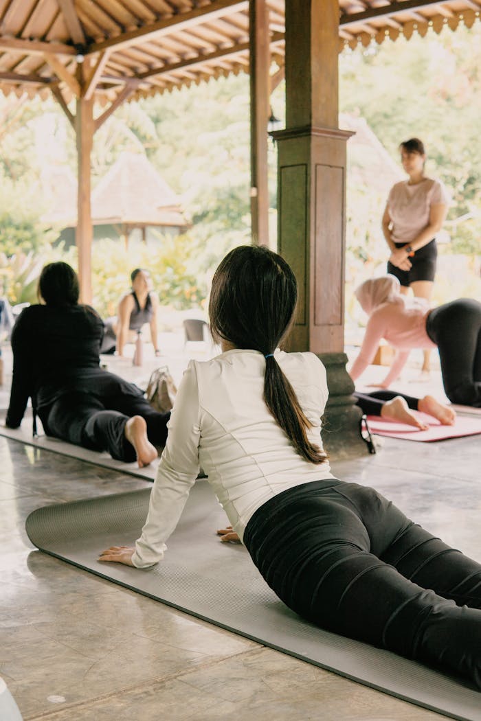 services-01 Outdoor yoga session in Jawa Barat, Indonesia featuring diverse participants practicing in tranquility.